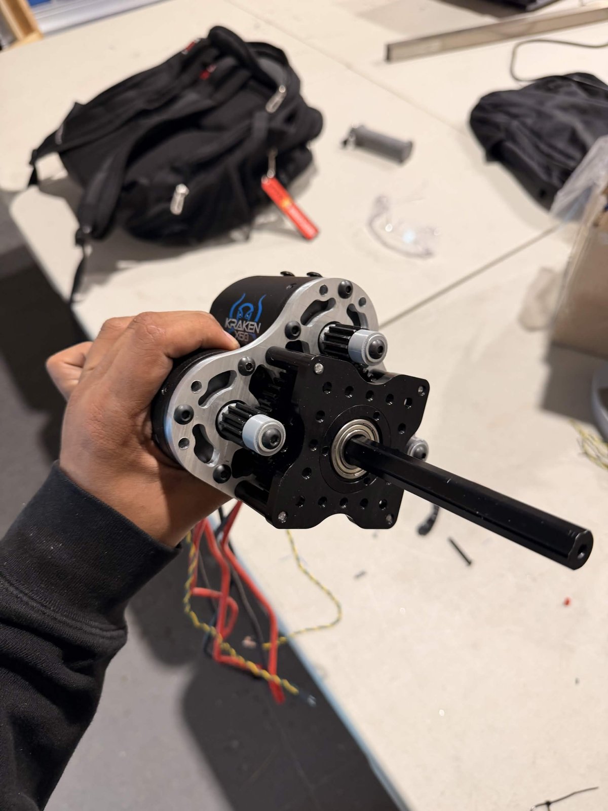 The three-Kraken gearbox assembly: 12-tooth pinions driving a shared 60-tooth output gear